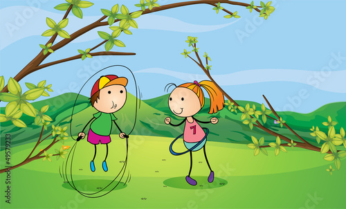 A boy and a girl playing in the hills