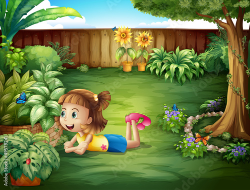 A little girl watching a butterfly
