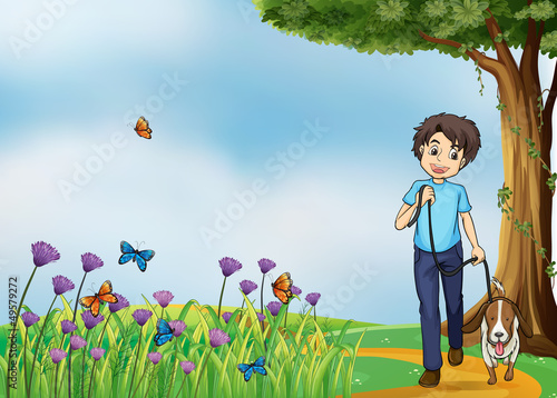 A young boy walking with his pet