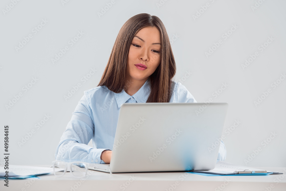 Portrait of a smiling beautiful young business woman working on Portrait of a smiling beautiful young business woman working on
