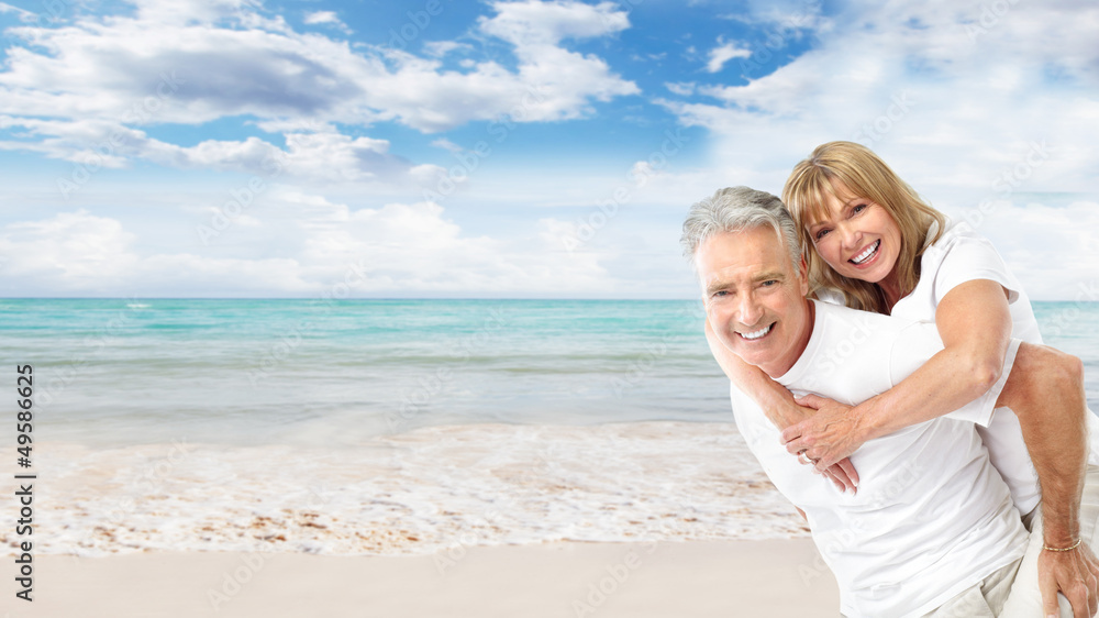 Happy senior couple on the beach.