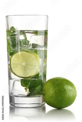 Glass of water with ice, mint and lime isolated on white © Africa Studio