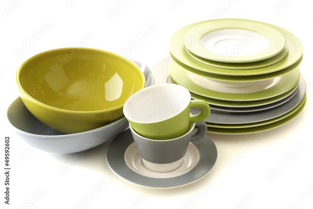 Empty bowls, plates and cups isolated on white Empty bowls, plates and cups isolated on white
