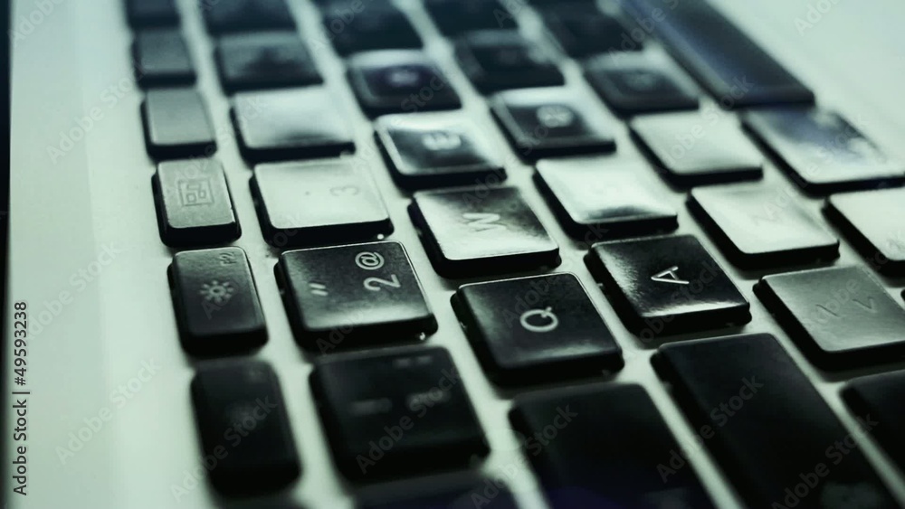 At symbol pressed by a finger on a laptop. At symbol pressed by a finger on a laptop.