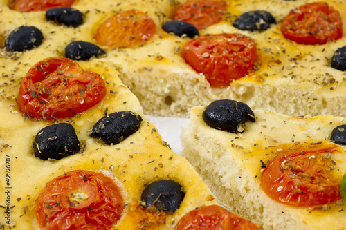 Focaccia with tomato and black olives