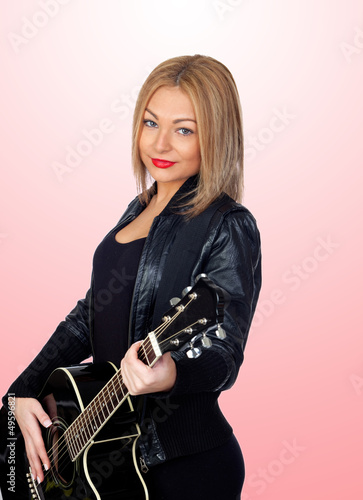 Pretty blond musician with a guitar