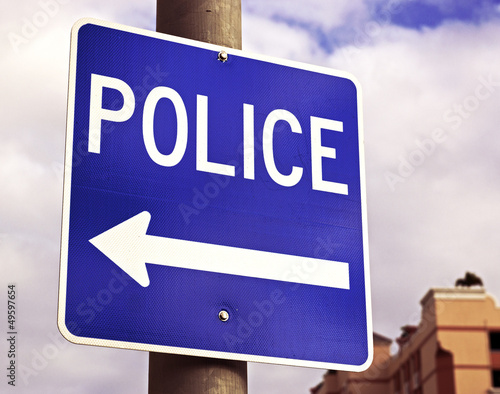 a sign points to the local police station.