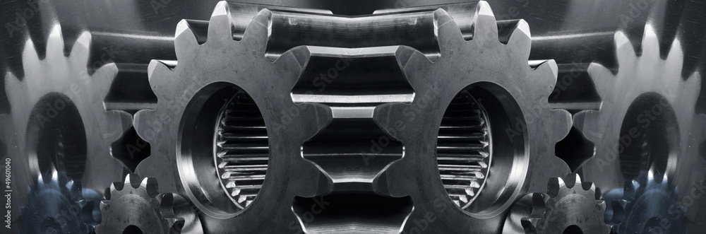 gears and cogwheels panoramic mirror image in blue toning gears and cogwheels panoramic mirror image in blue toning