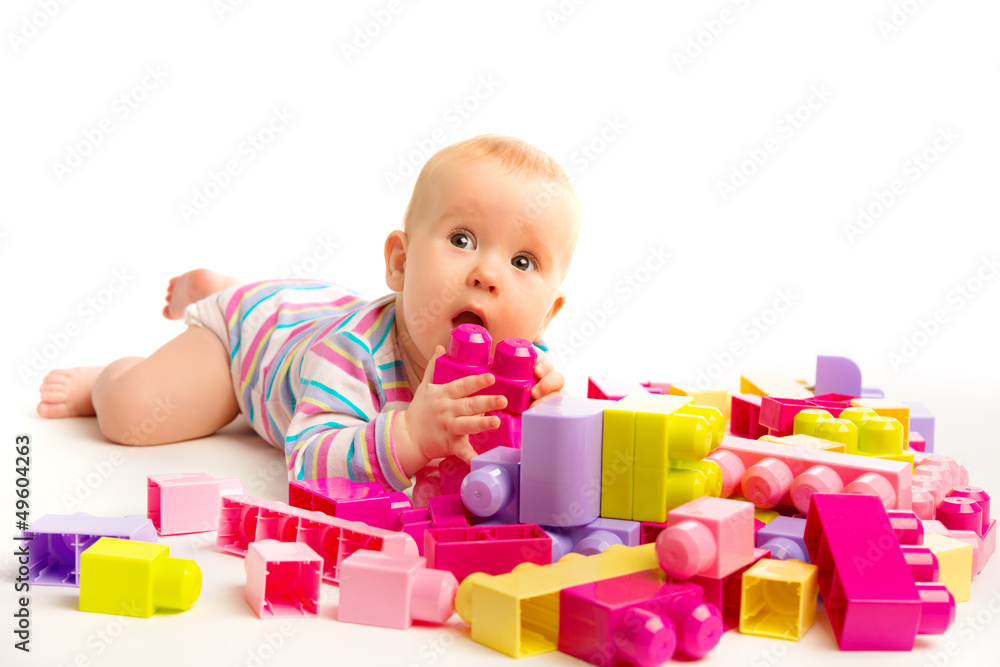 baby playing in designer toy blocks baby playing in designer toy blocks