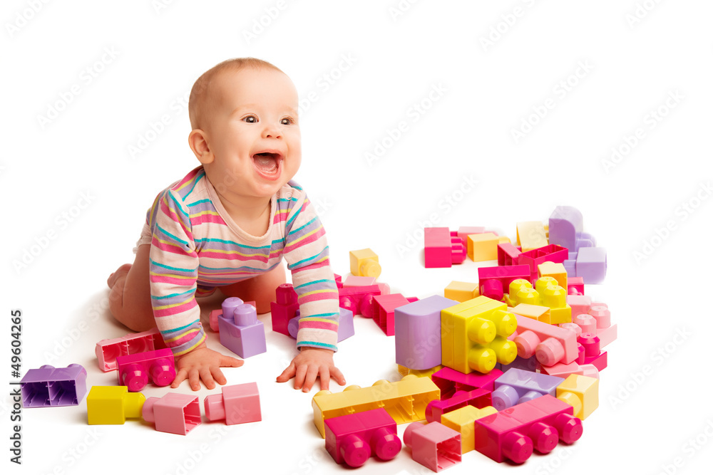 baby playing in designer toy blocks baby playing in designer toy blocks