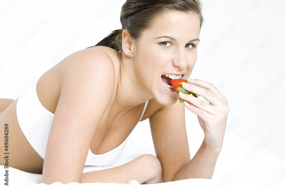 portrait of lying down woman with a strawberry portrait of lying down woman with a strawberry
