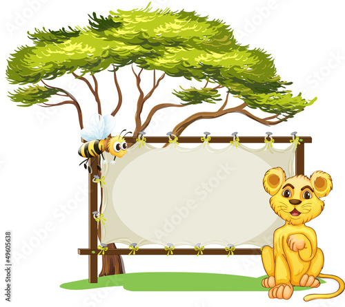 A young animal and a bee beside the empty signage