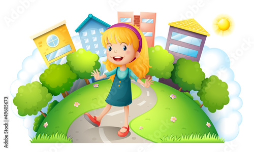A girl at the top of the hill with buildings