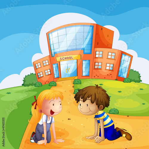 Two kids in front of the school