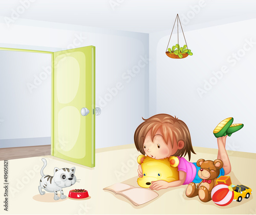 A girl inside a room with a cat and toys