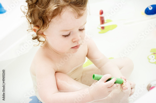 Baby in the bath doing pedicure