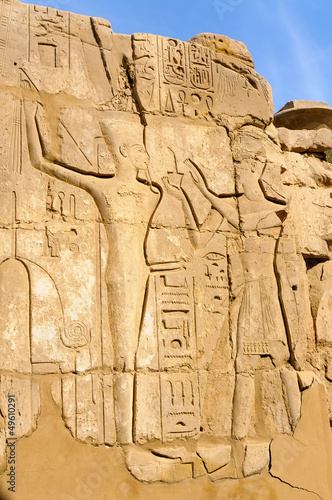 Bas relief and hieroglyphs in the Karnak temple of Luxor, Egypt
