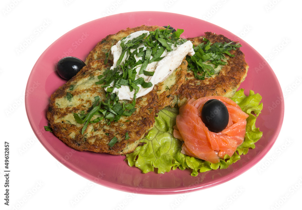 Roasted cutlets of potato with salmon on a plate Roasted cutlets of potato with salmon on a plate