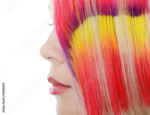 girl with a bright make-up and multi-coloured strand in hair