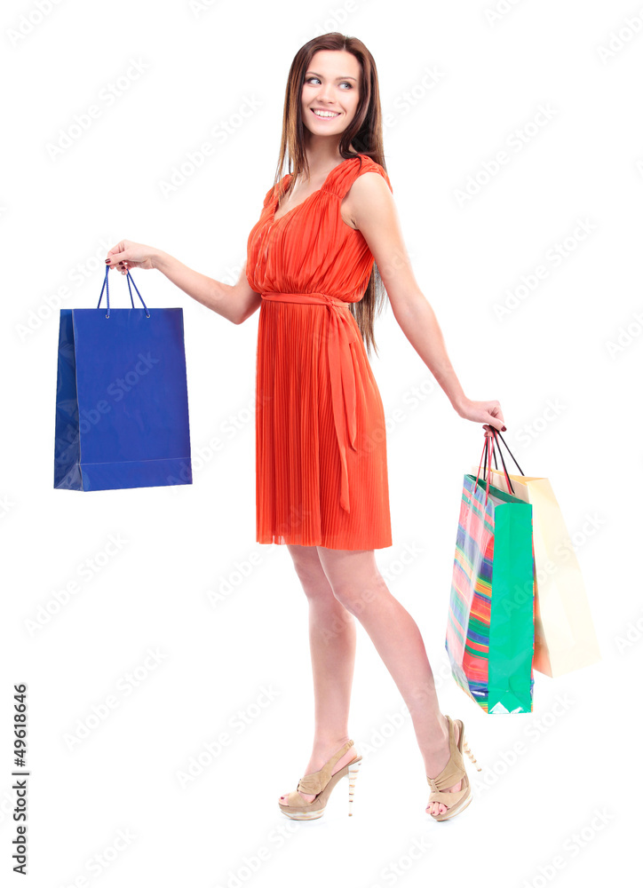 Portrait of young happy smiling woman with shopping bags