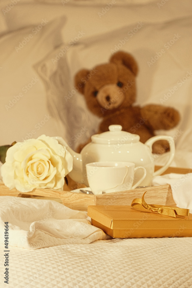 Breakfast in bed with tea and gift