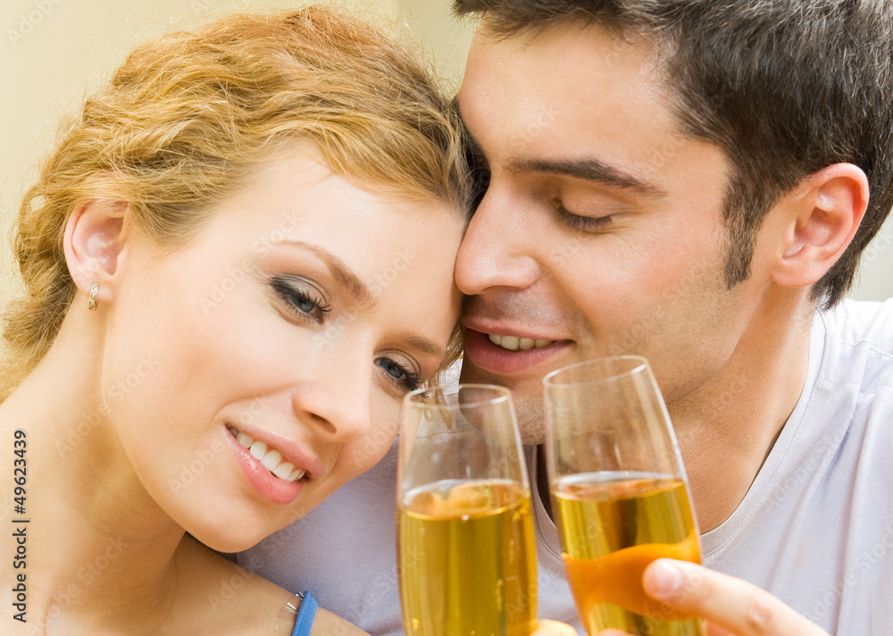 Cheerful couple with champagne Cheerful couple with champagne