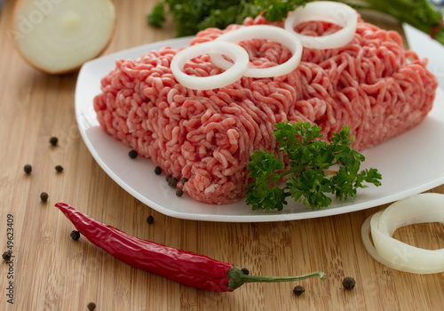 minced meat on the wooden cutting board
