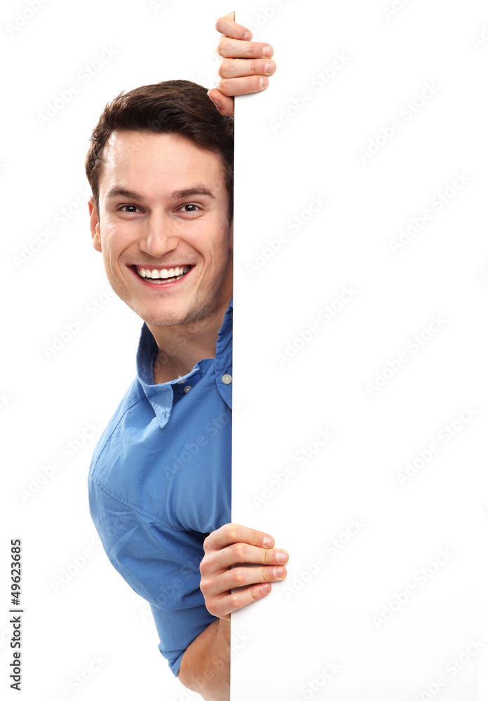 Man peeping over blank poster Man peeping over blank poster