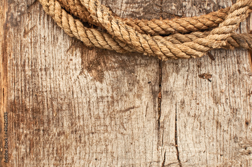 Ship rope and weathered wood background