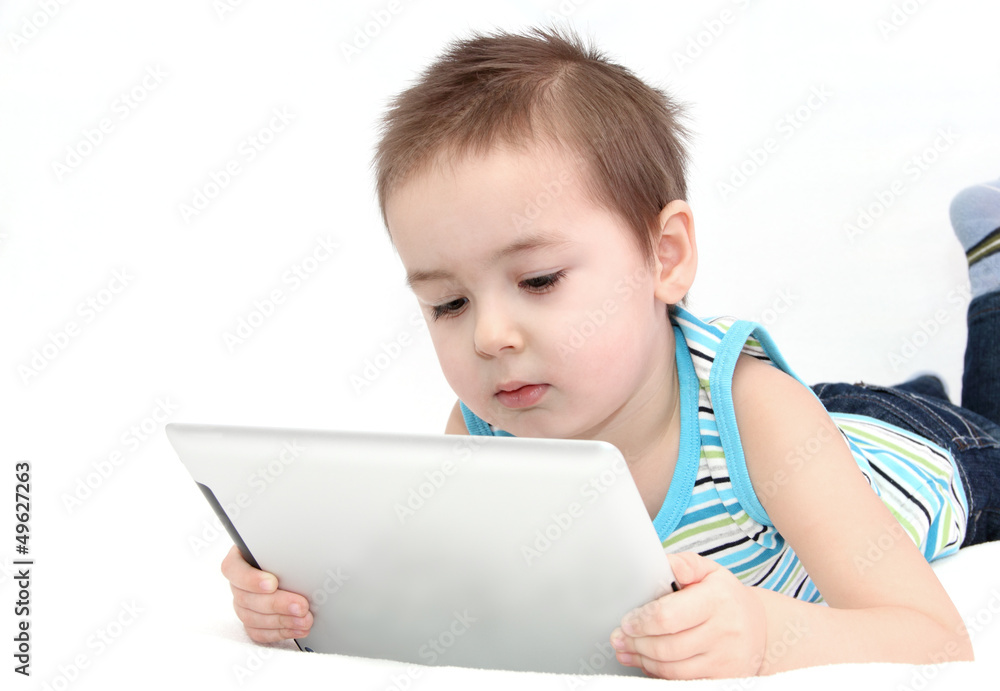 Child using a digital tablet Child using a digital tablet