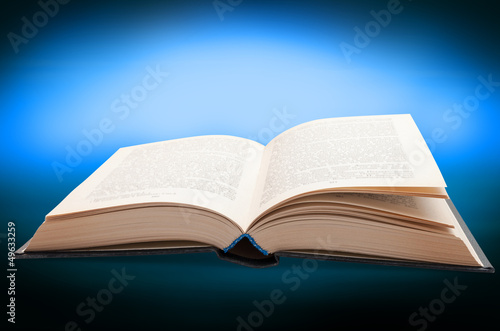 Book opened on Blue Background