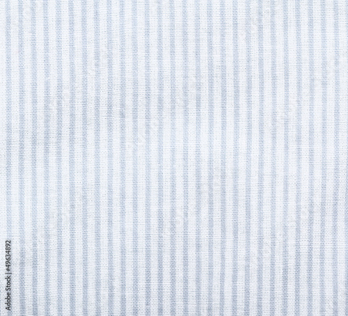 White striped fabric texture. Clothes background. Close up