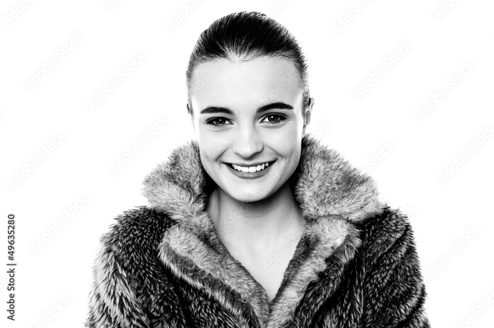 Smiling attractive girl in furry overcoat Smiling attractive girl in furry overcoat