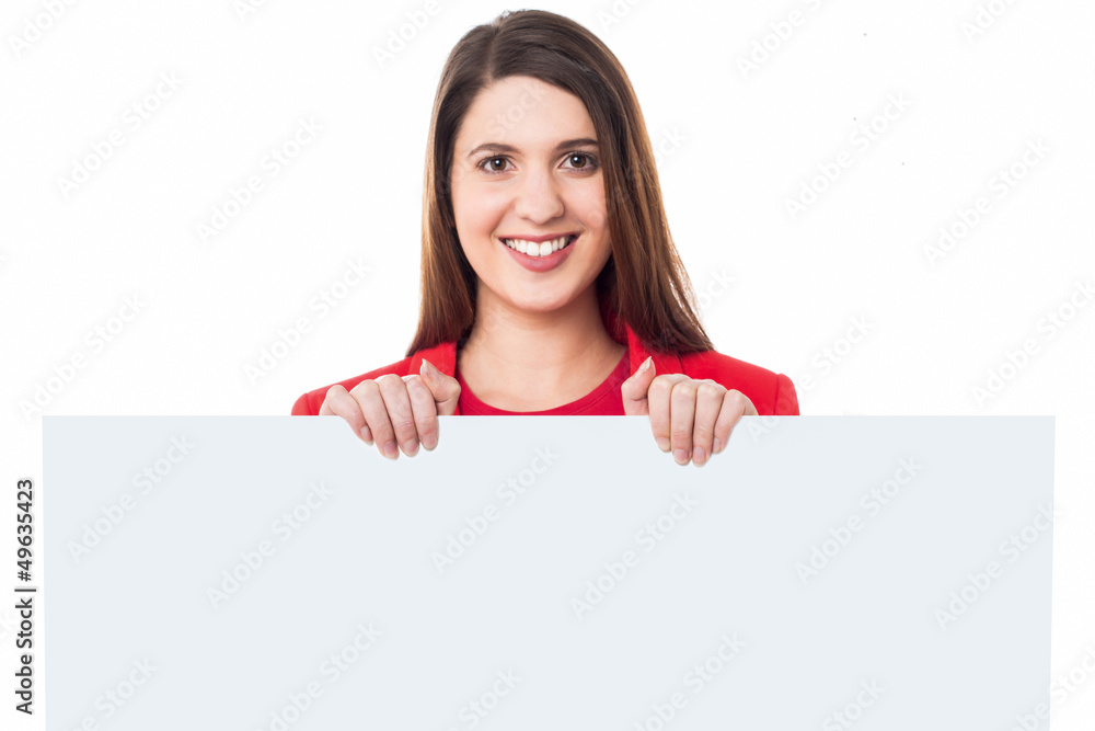 Pretty young girl standing behind banner ad