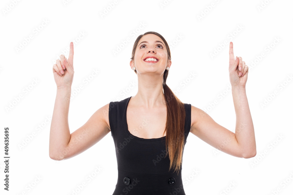 Excited young girl looking and pointing upwards Excited young girl looking and pointing upwards