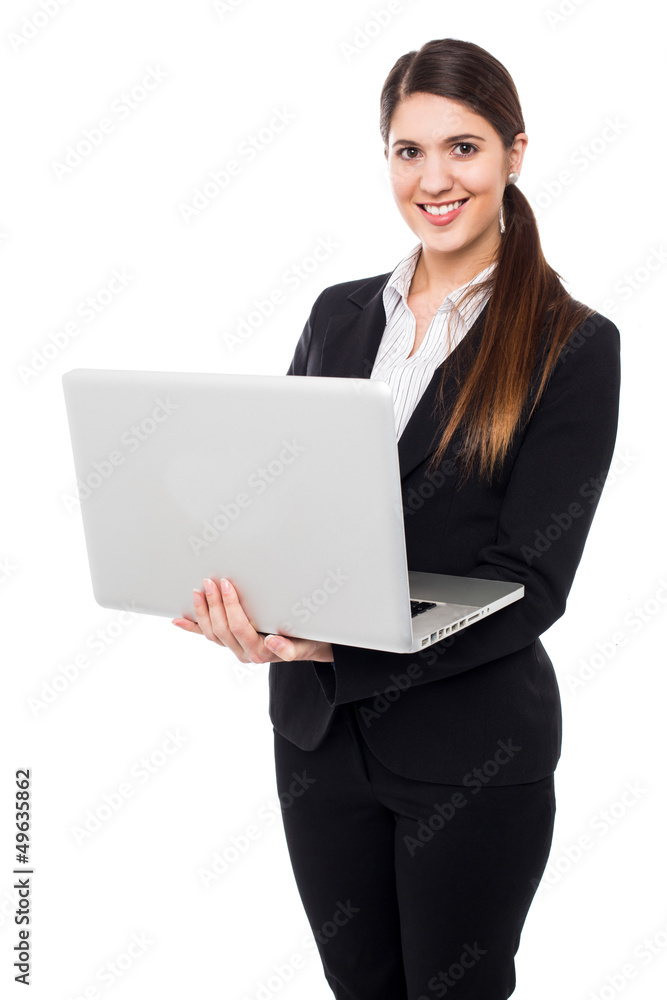Young woman in formals posing with a laptop Young woman in formals posing with a laptop