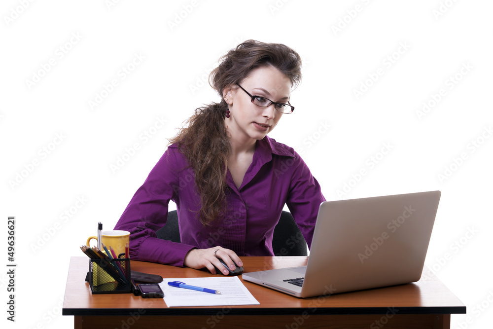 Angry businesswoman at the desk isolated over white Angry businesswoman at the desk isolated over white