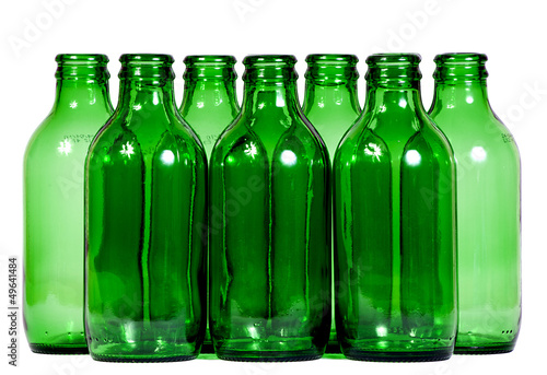 Green glass bottles against white