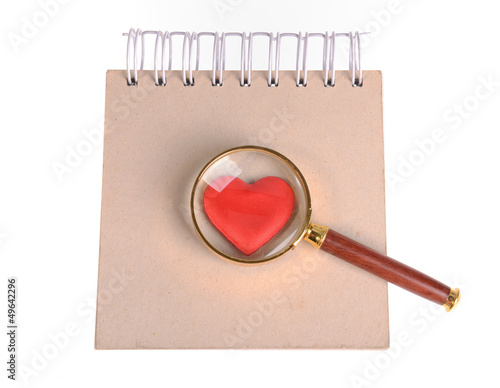 magnifying glass,red hearts and sticky note photo