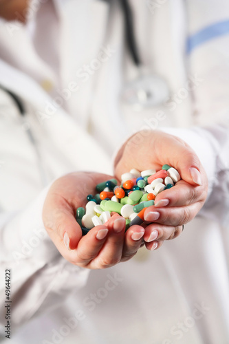 Doctor with pills in her hands