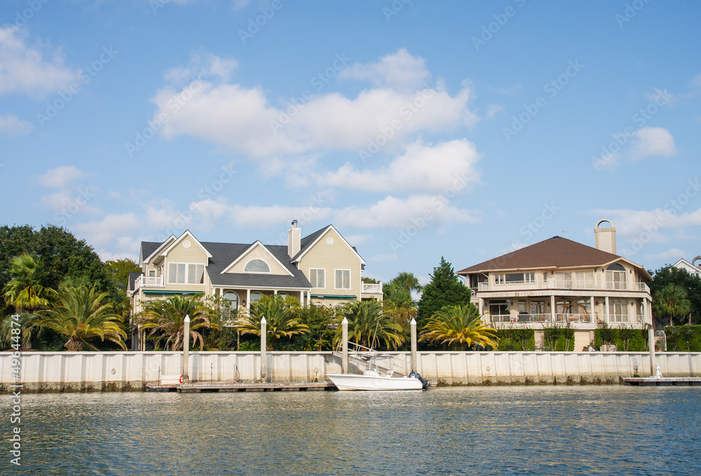 Two Coastal Homes with Small Boat