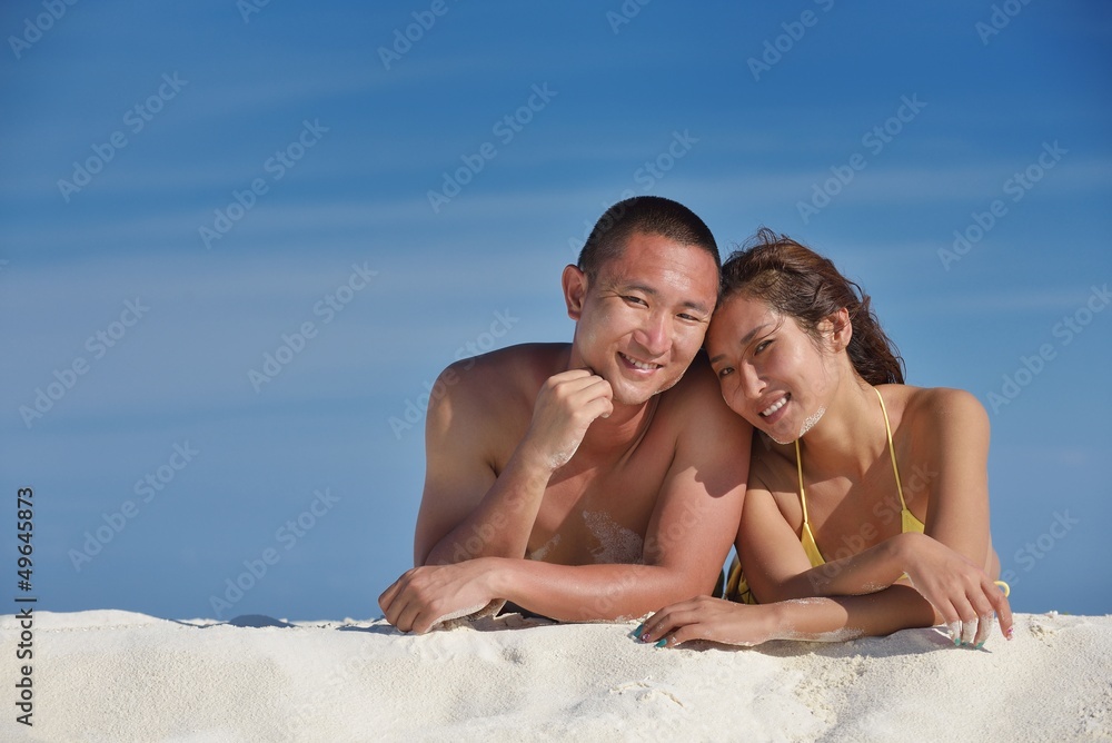 happy young couple enjoying summer on beach happy young couple enjoying summer on beach