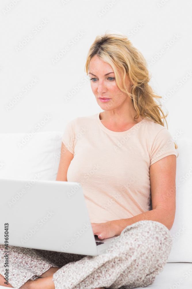 Calm woman using a laptop Calm woman using a laptop