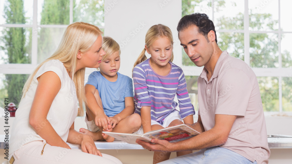 Calm family reading a story together Calm family reading a story together