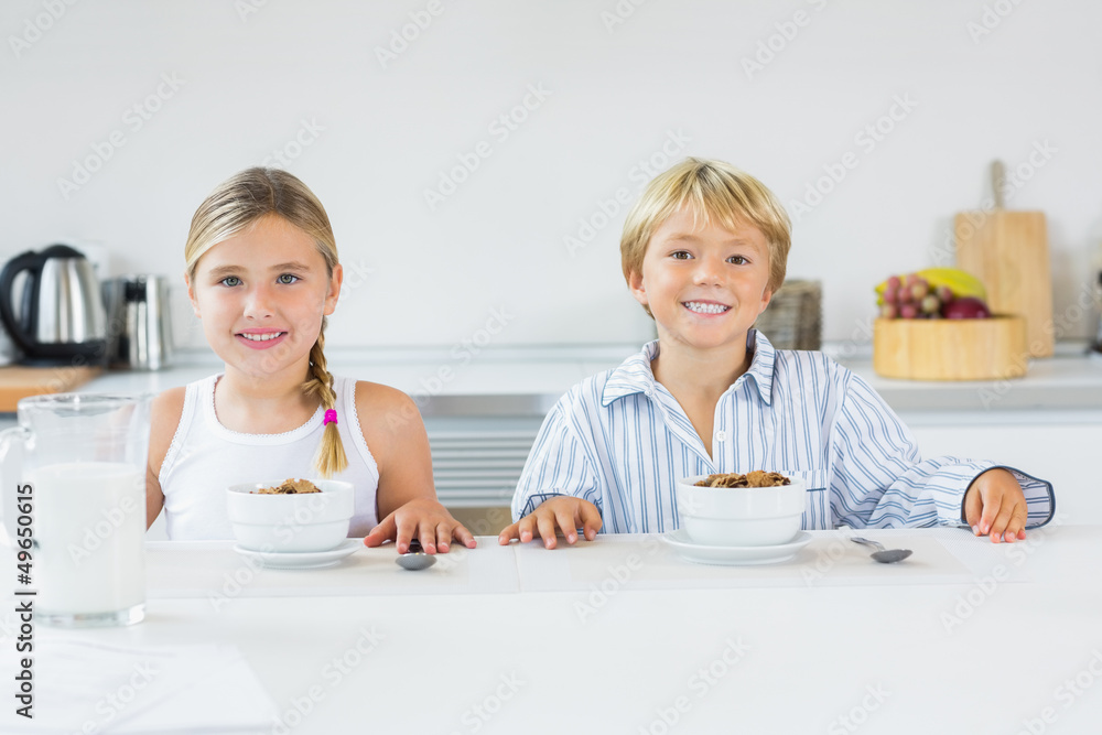 Brother and sister having breakfast Brother and sister having breakfast