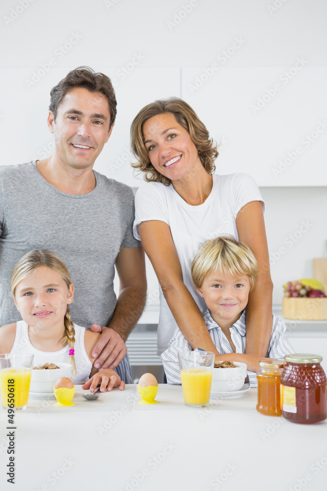 Smiling family at breakfast