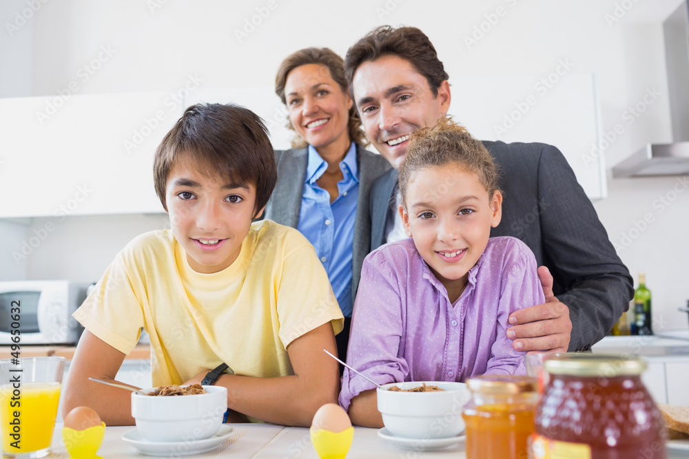 Happy family having breakfast together Happy family having breakfast together