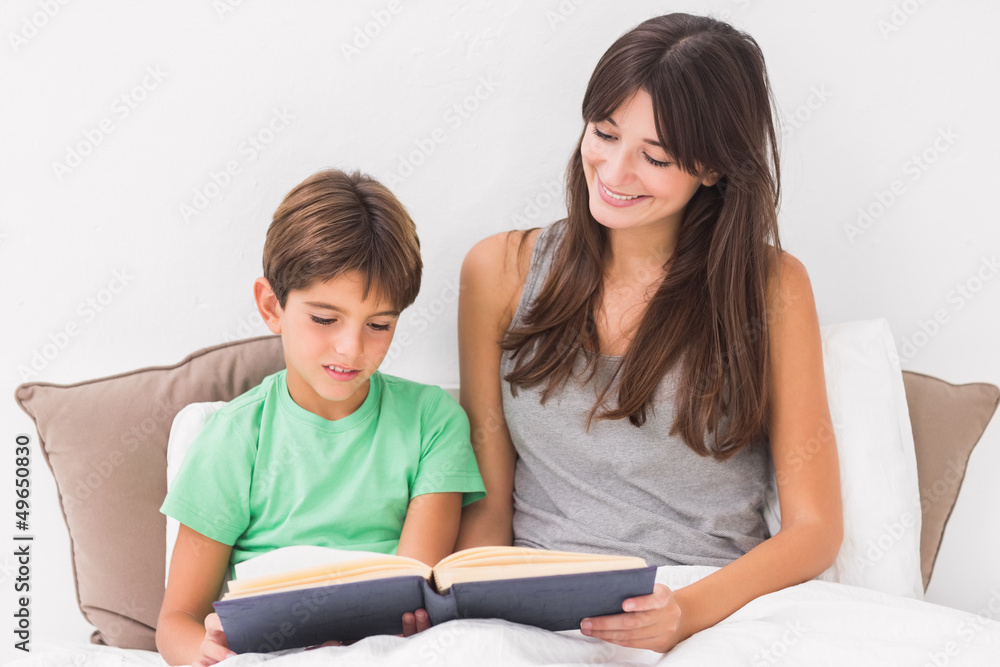 Mother and son reading in bed Mother and son reading in bed