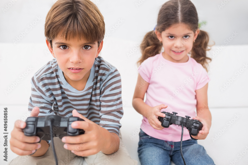 Brother and sister playing video games Brother and sister playing video games