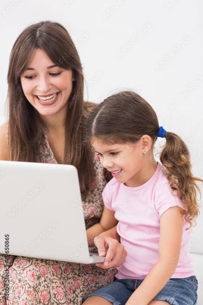 Happy mother and daughter using laptop Happy mother and daughter using laptop